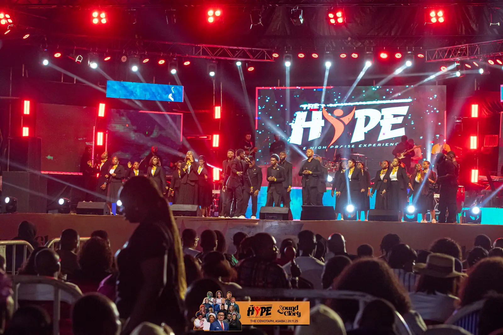 The HYPE stage lit up in red with the choir in full voice